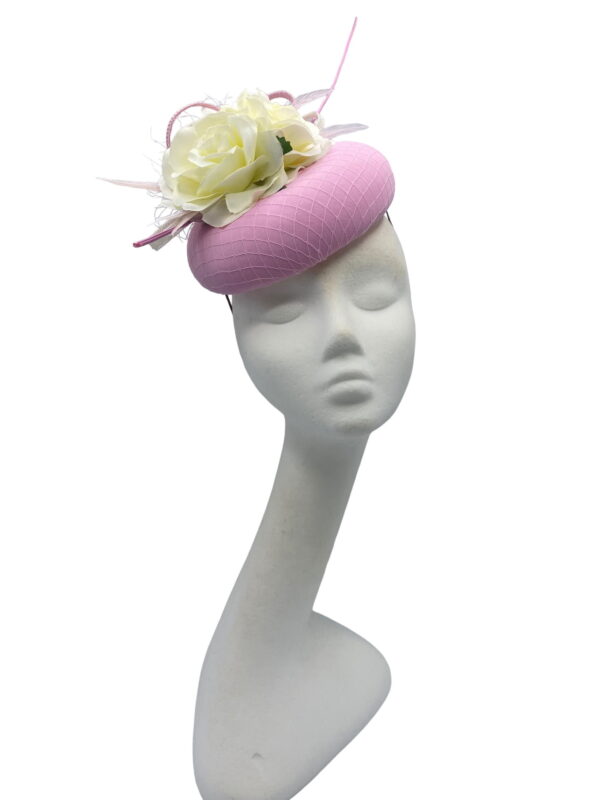 Stunning pink headpiece with ivory flower detail.